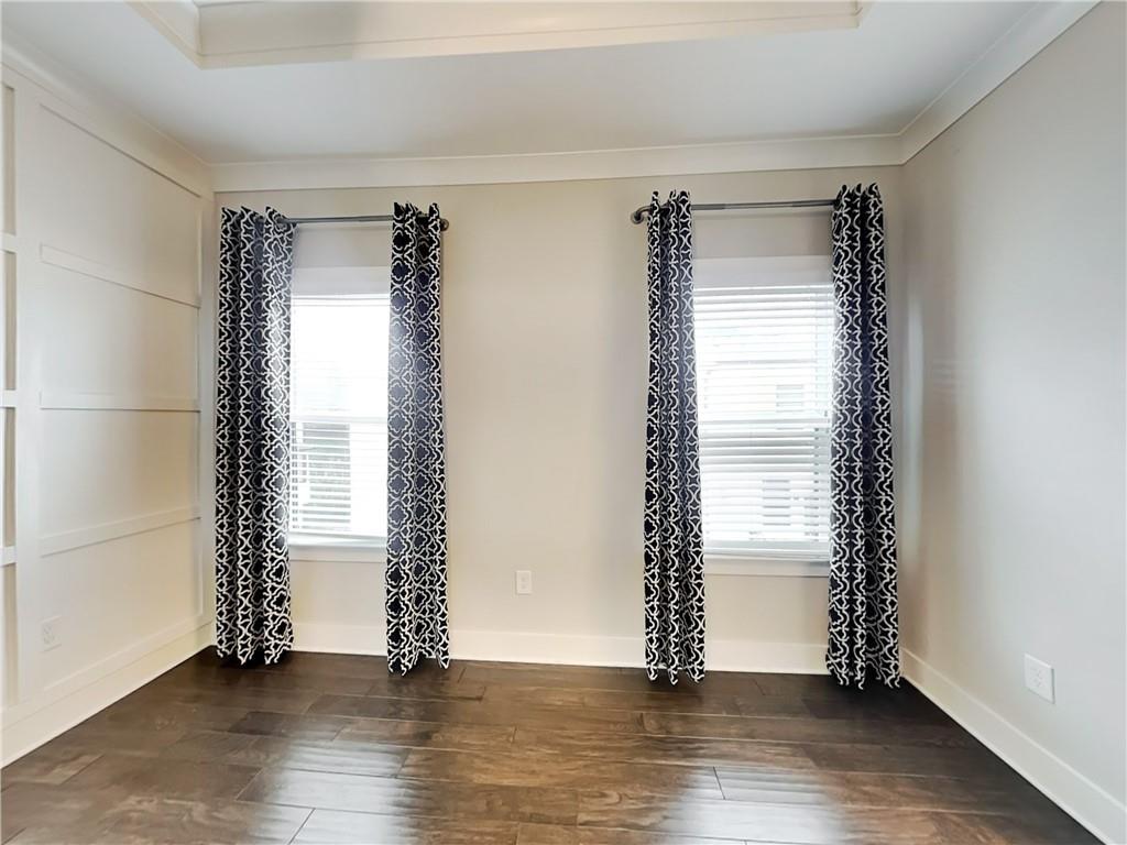 2038 Rockledge Road Northeast Atlanta, GA 30324 - Photo 6 of 21 an empty room with wooden floor and windows