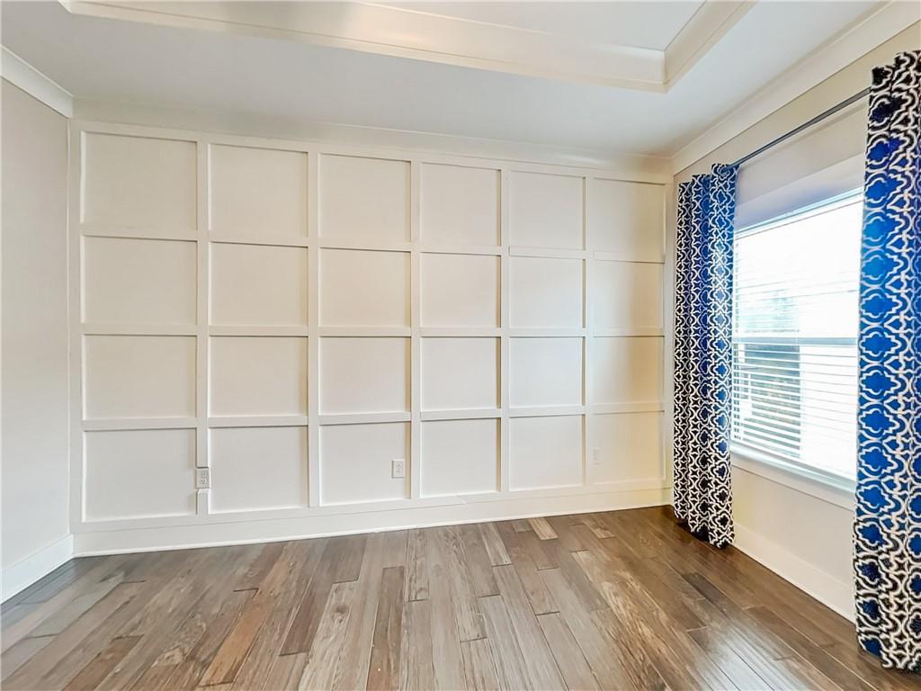 2038 Rockledge Road Northeast Atlanta, GA 30324 - Photo 7 of 21 an empty room with wooden floor and windows