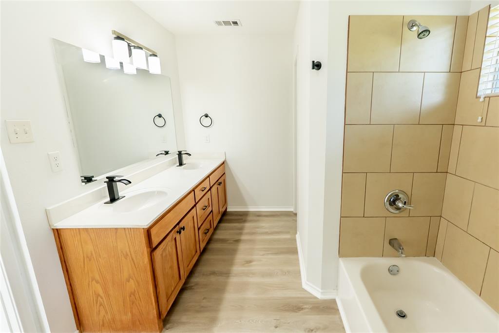 413 Bethlehem Street Terrell, TX 75160 - Photo 12 of 16 a bathroom with a sink and a bathtub