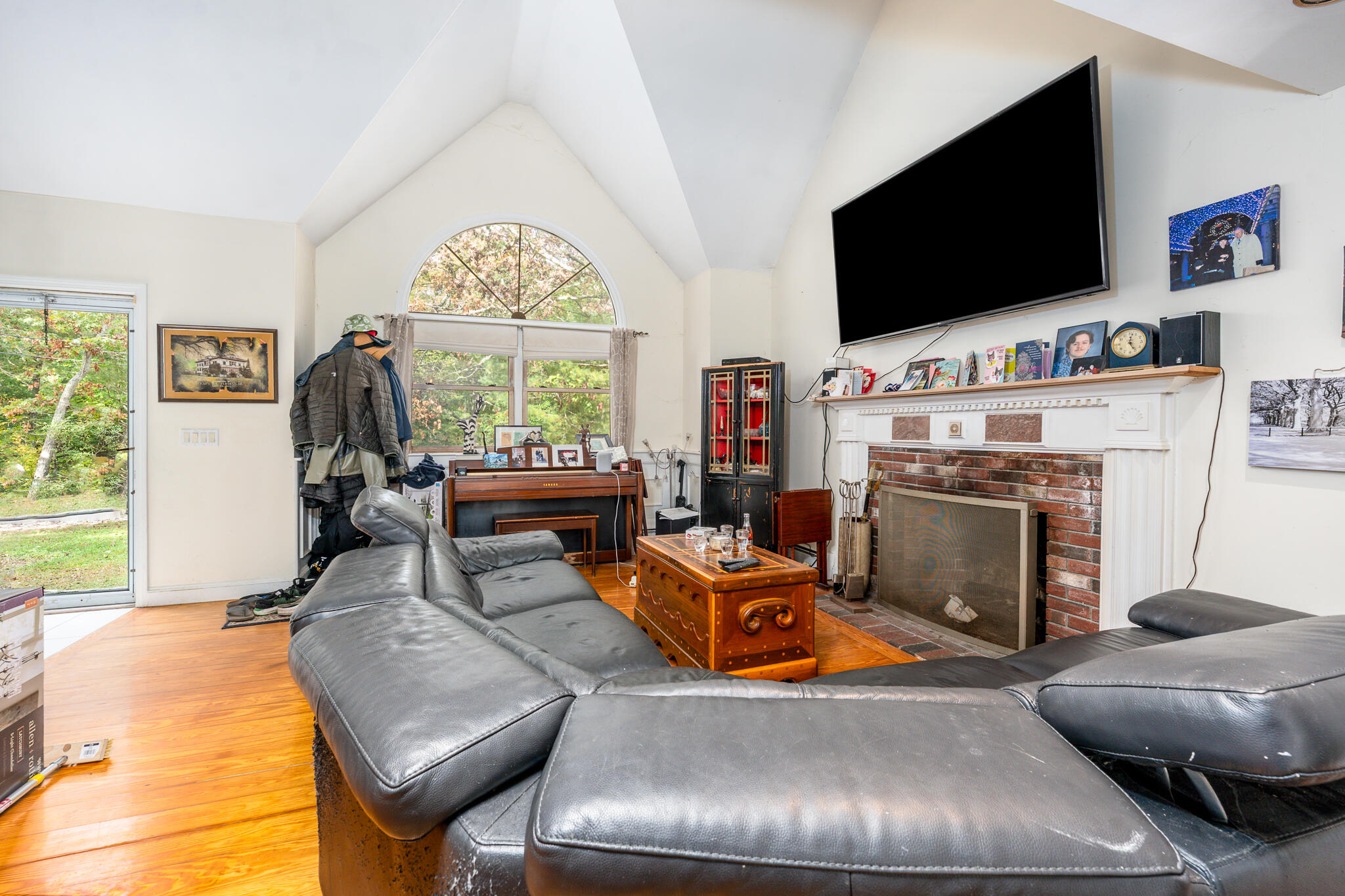 191 James Circle Mashpee, MA 02649 - Photo 4 of 12 a living room with furniture and a flat screen tv