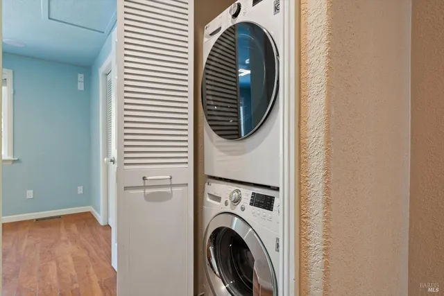 a view of a hallway with washer and dryer