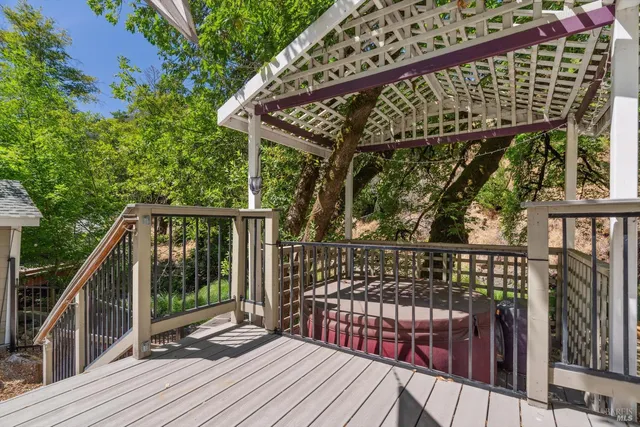 a view of balcony with wooden floor and outdoor seating