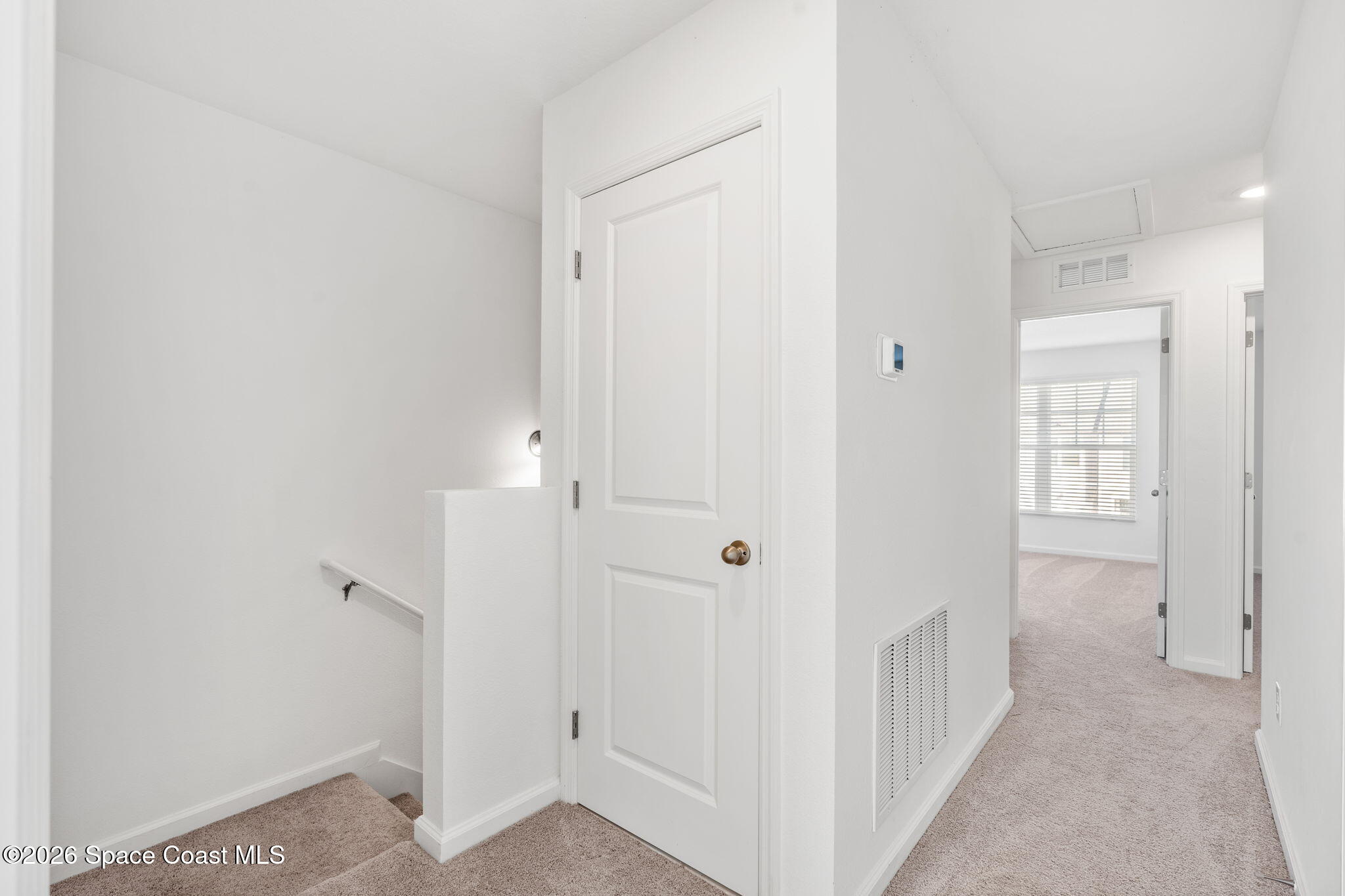 2117 Topsail Way Rockledge, FL 32955 - Photo 11 of 16 a view of a hallway with two rooms