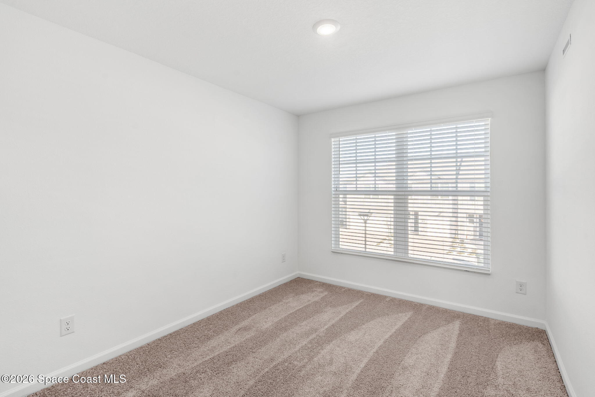 2117 Topsail Way Rockledge, FL 32955 - Photo 12 of 16 a view of an empty room with a window