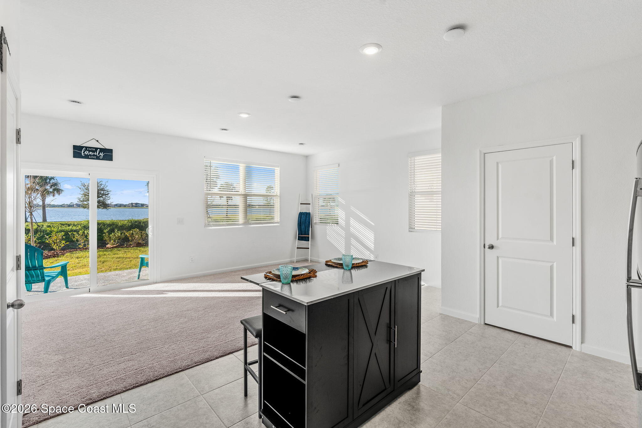 2117 Topsail Way Rockledge, FL 32955 - Photo 5 of 16 a kitchen that has a lot of cabinets in it