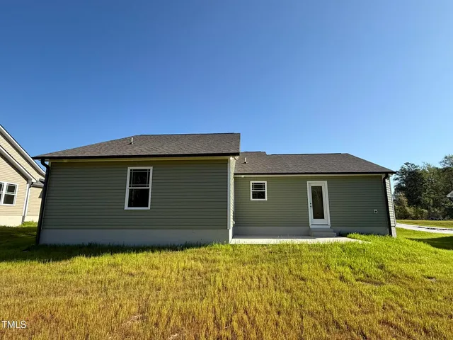 a house with yard in front of it