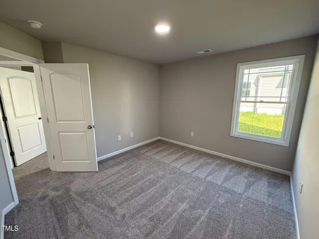 an empty room with a natural light