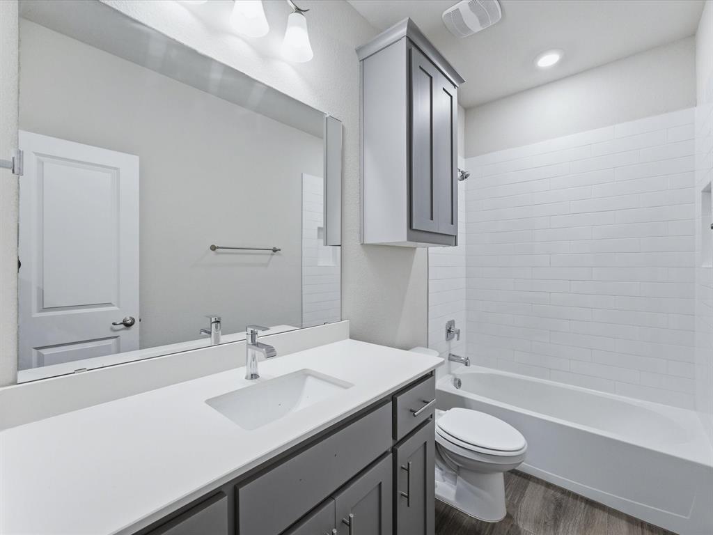 1121 Knightsbridge Road Argyle, TX 76226 - Photo 26 of 39 Bathroom featuring a white subway-tiled tub and shower combination