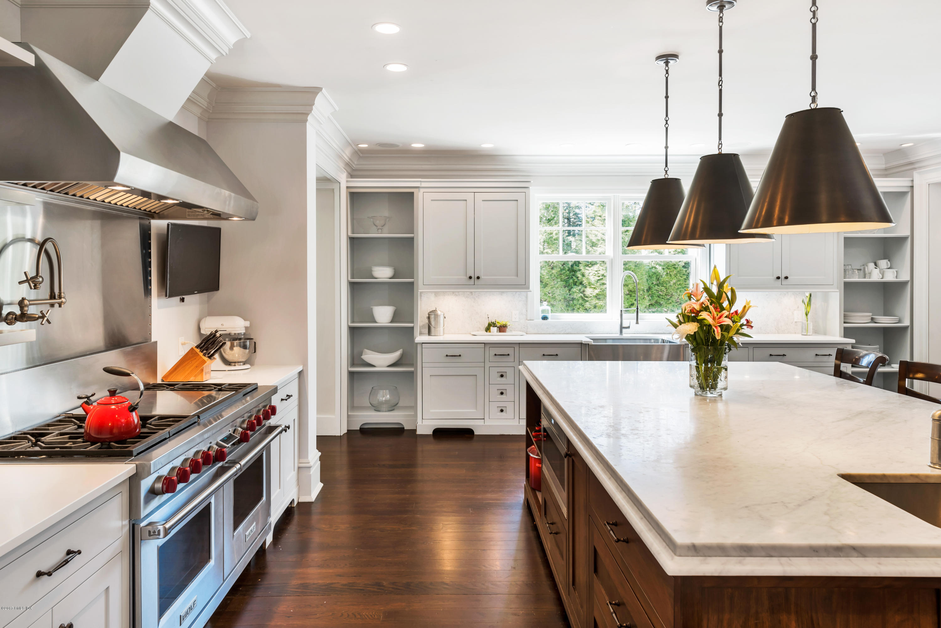136 Parsonage Road Greenwich, CT 06830 - Photo 12 of 35 a kitchen with stainless steel appliances granite countertop a stove a sink and a refrigerator