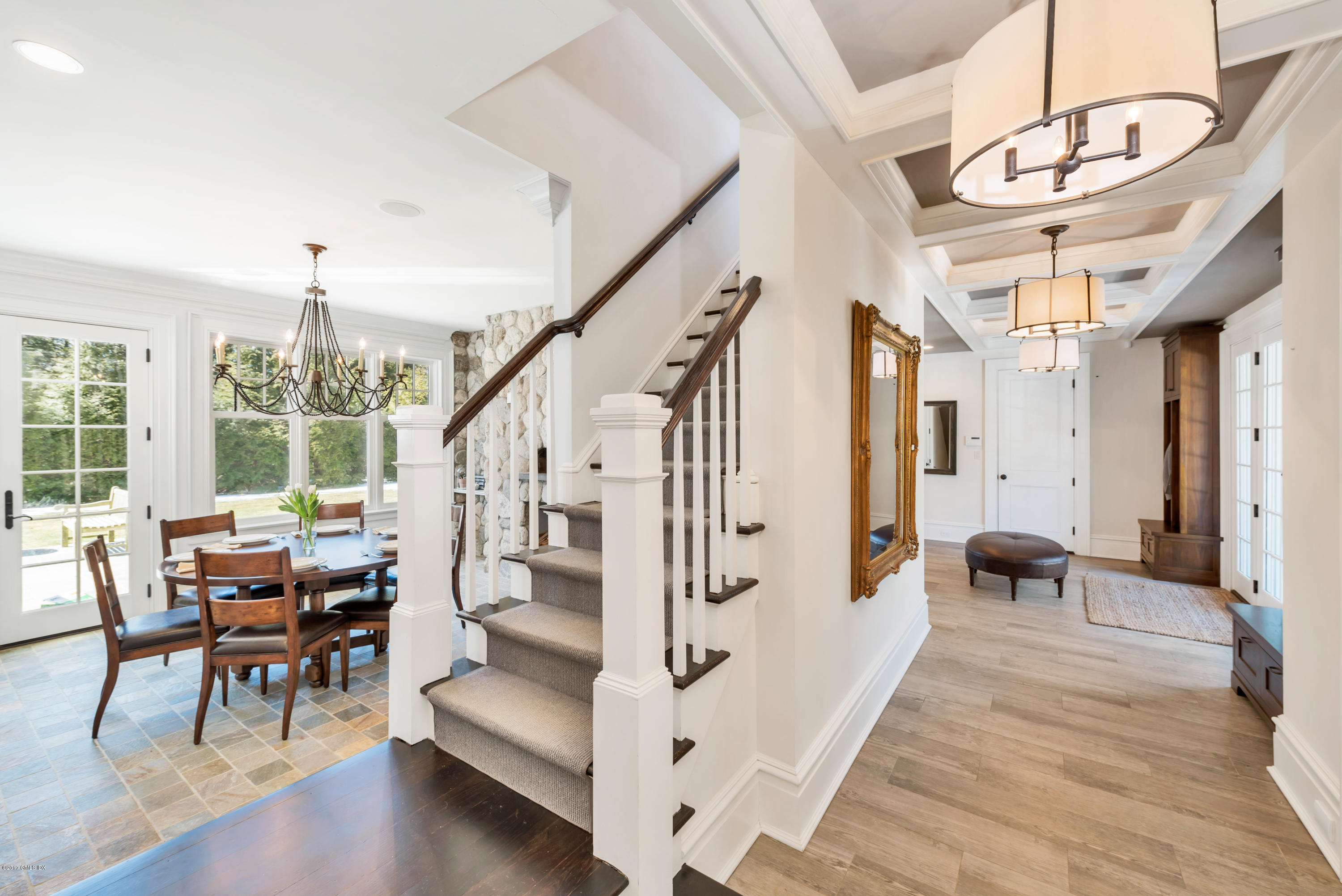 136 Parsonage Road Greenwich, CT 06830 - Photo 14 of 35 a living room with furniture and a chandelier