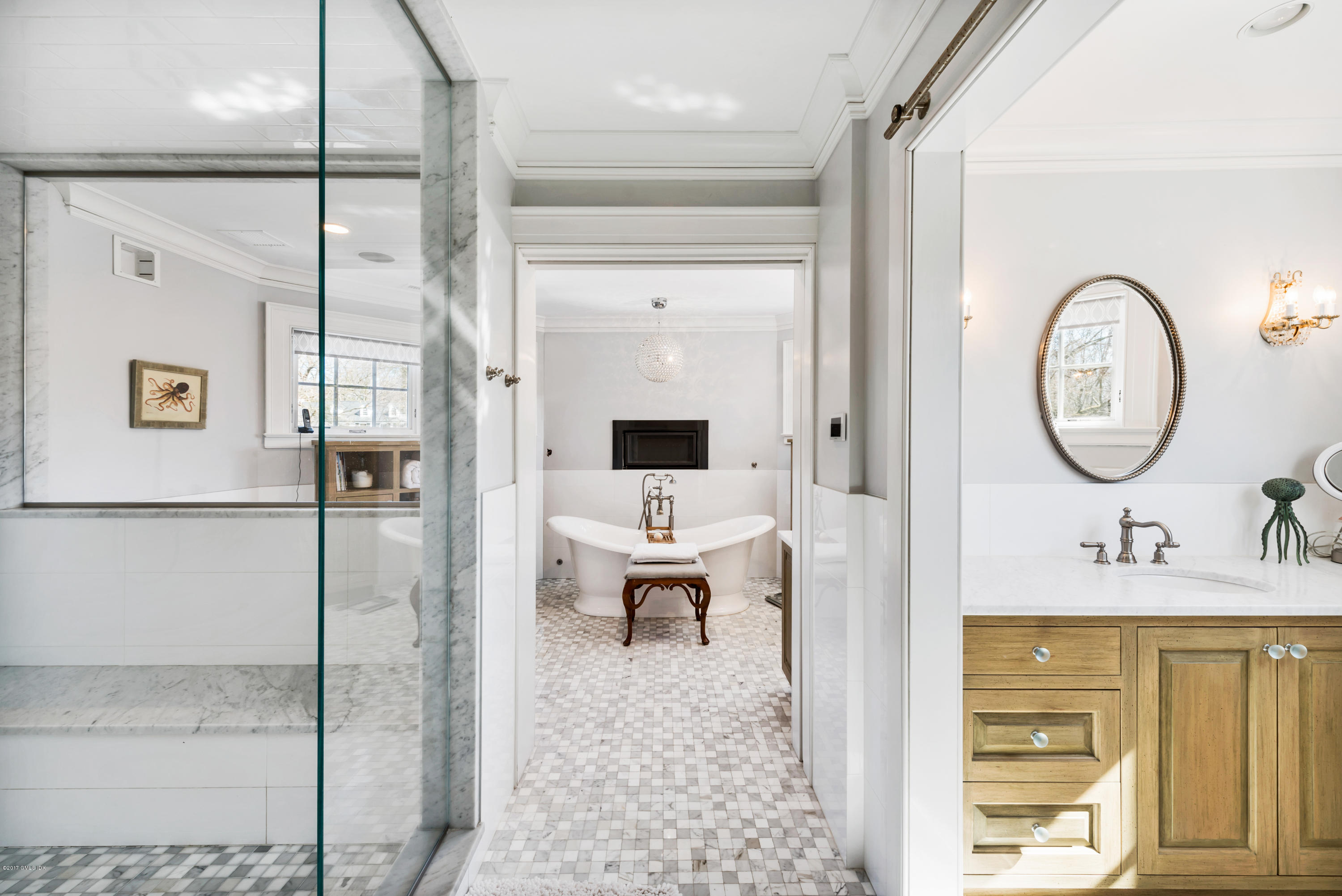 136 Parsonage Road Greenwich, CT 06830 - Photo 17 of 35 a bathroom with a sink a mirror and a shower