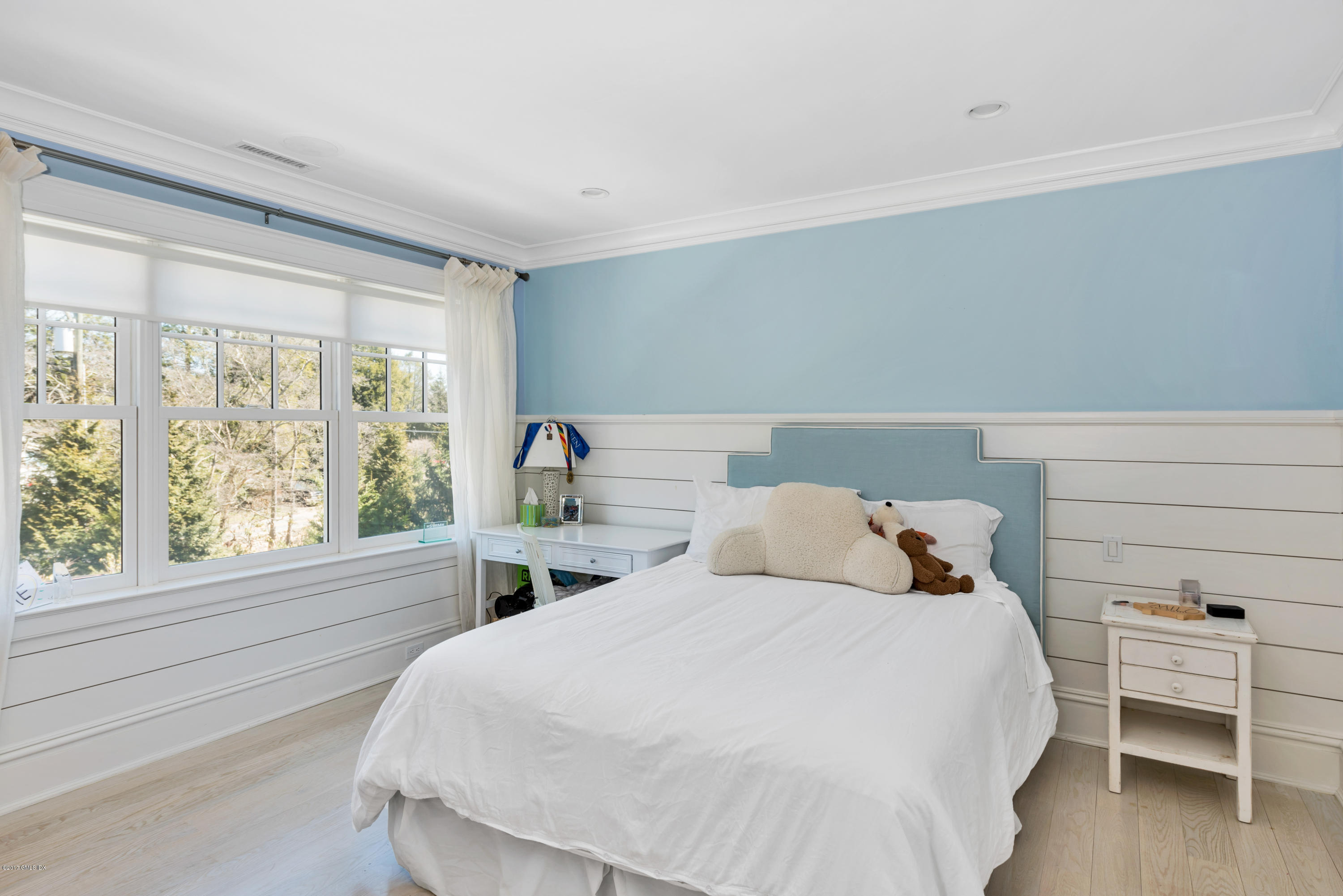 136 Parsonage Road Greenwich, CT 06830 - Photo 18 of 35 a bedroom with a bed and a large window