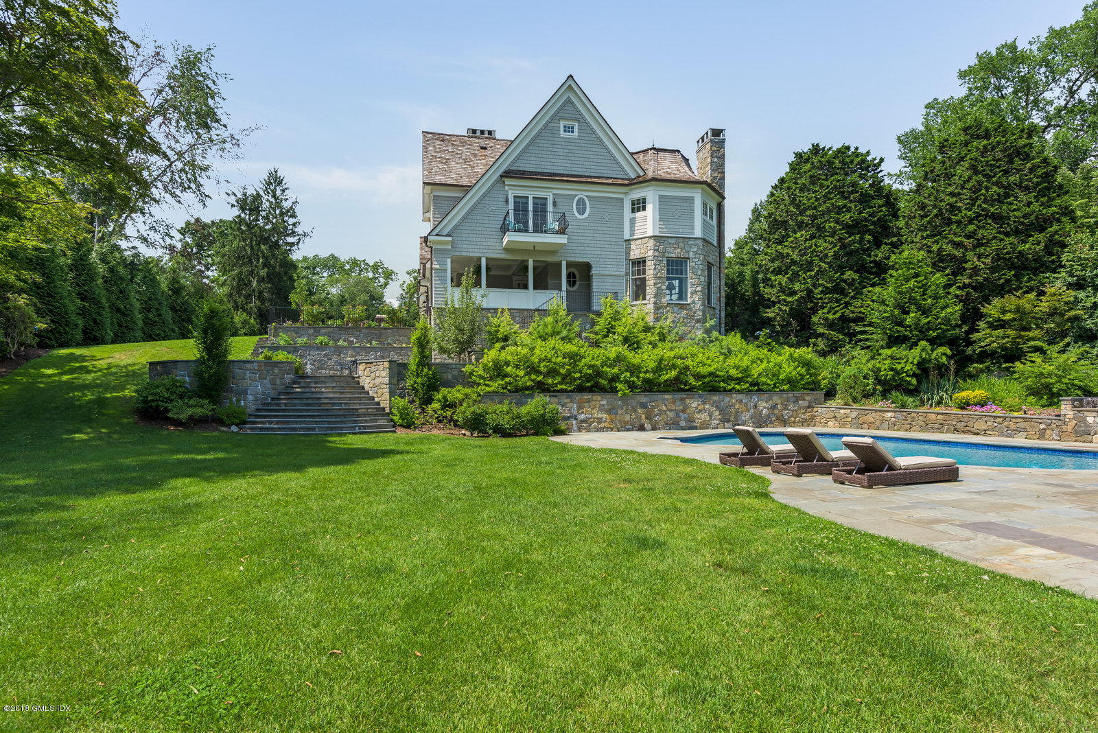 136 Parsonage Road Greenwich, CT 06830 - Photo 24 of 35 a front view of a house with garden
