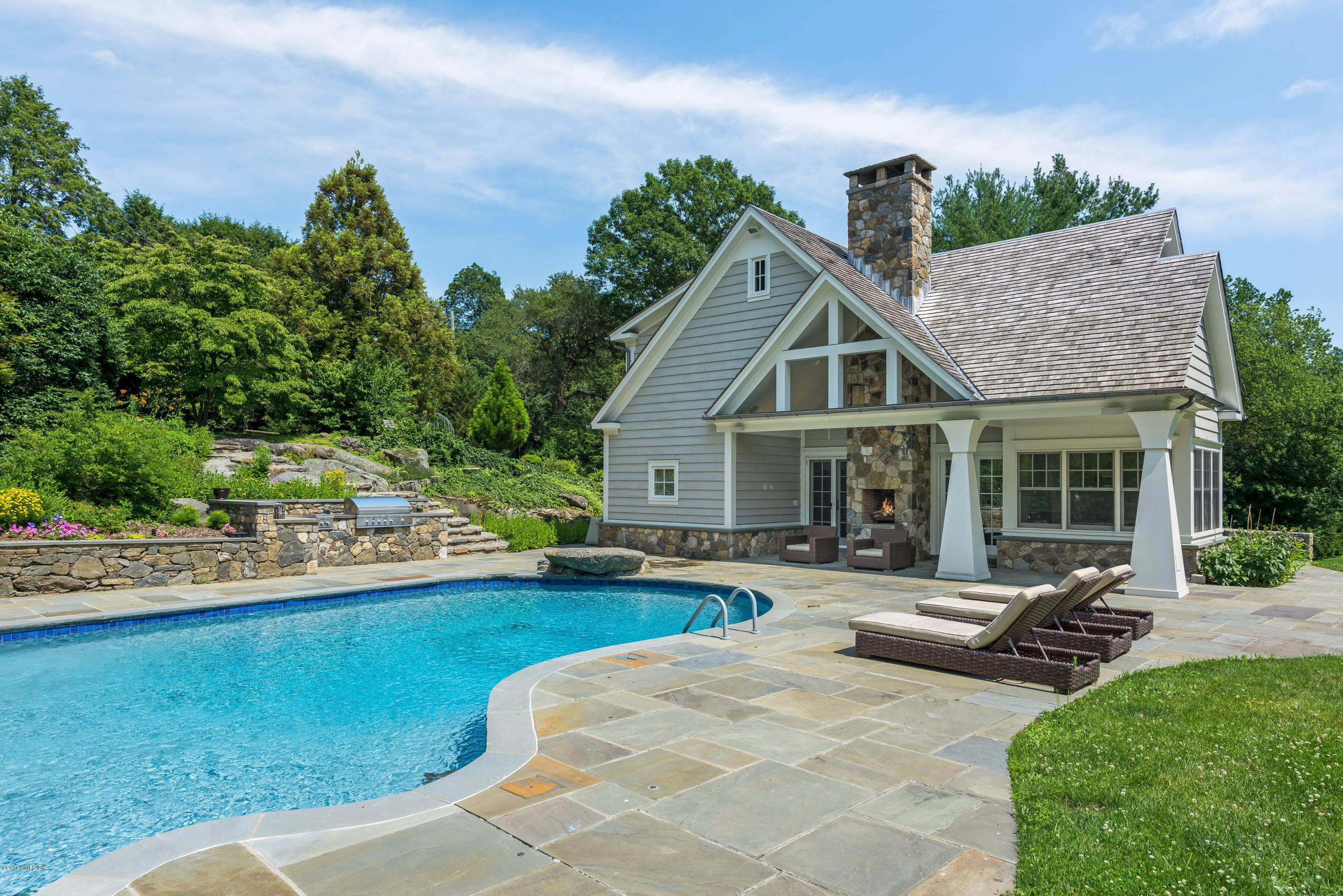 136 Parsonage Road Greenwich, CT 06830 - Photo 25 of 35 a view of a house with backyard sitting area and garden