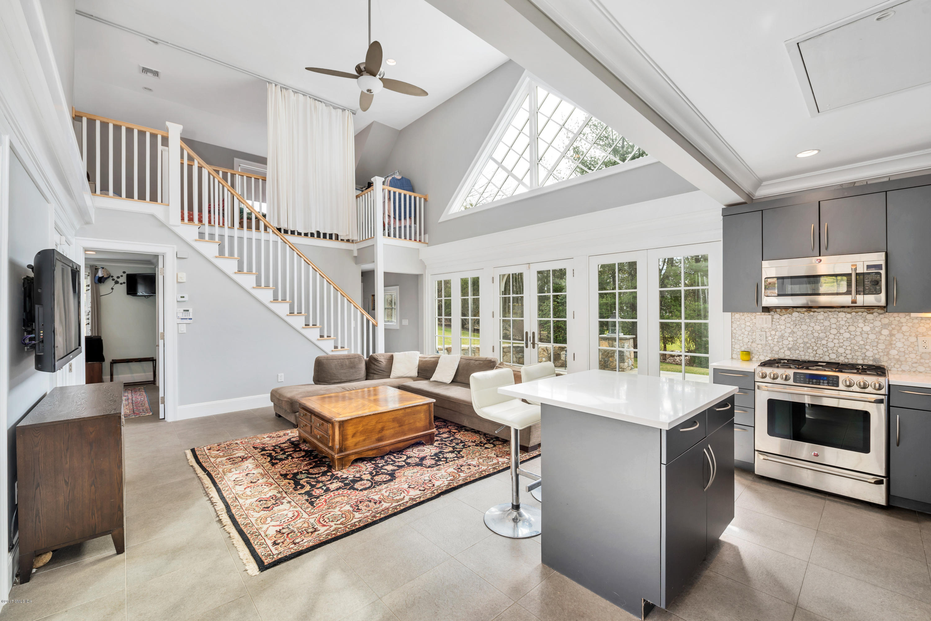 136 Parsonage Road Greenwich, CT 06830 - Photo 27 of 35 a living room with furniture and a fireplace