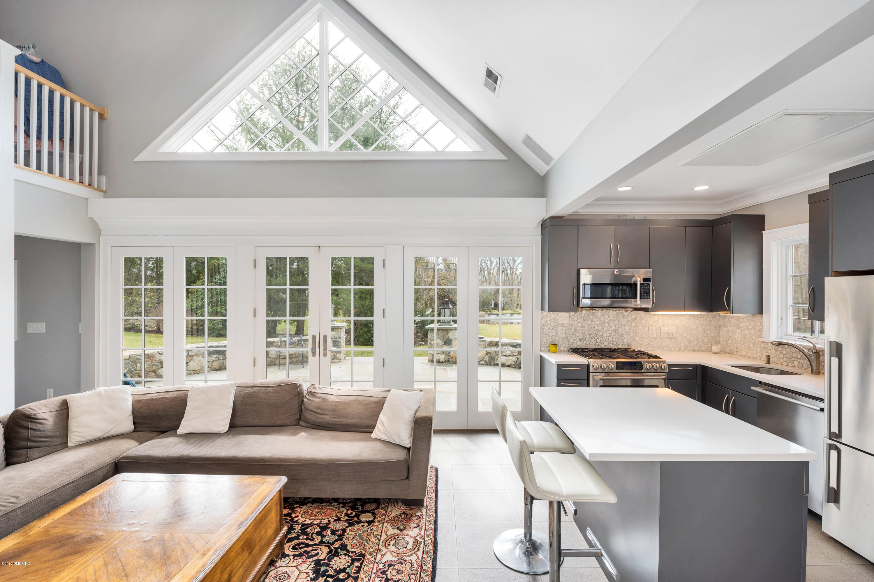 136 Parsonage Road Greenwich, CT 06830 - Photo 28 of 35 a living room with furniture and a large window