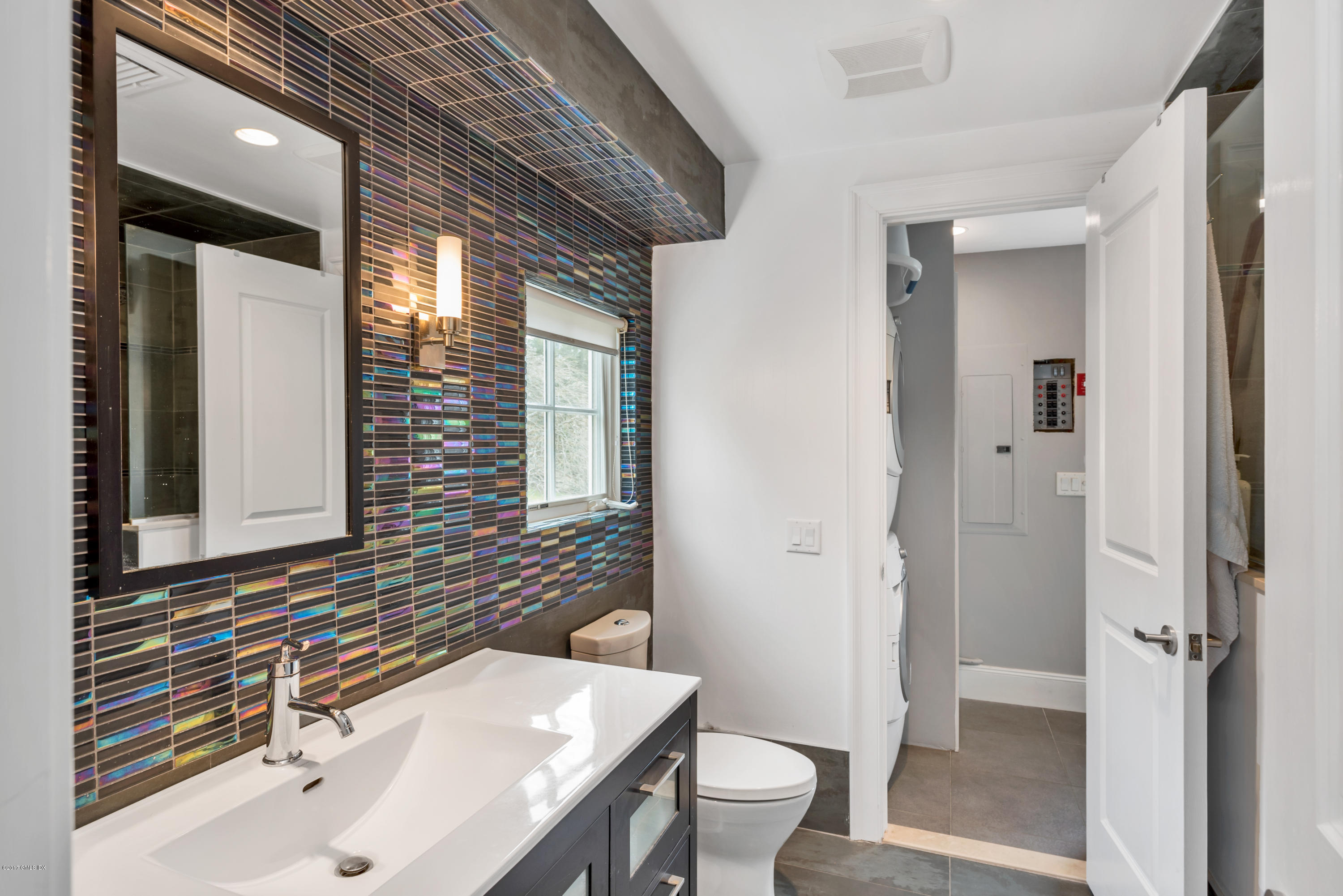 136 Parsonage Road Greenwich, CT 06830 - Photo 29 of 35 a bathroom with a sink and a mirror