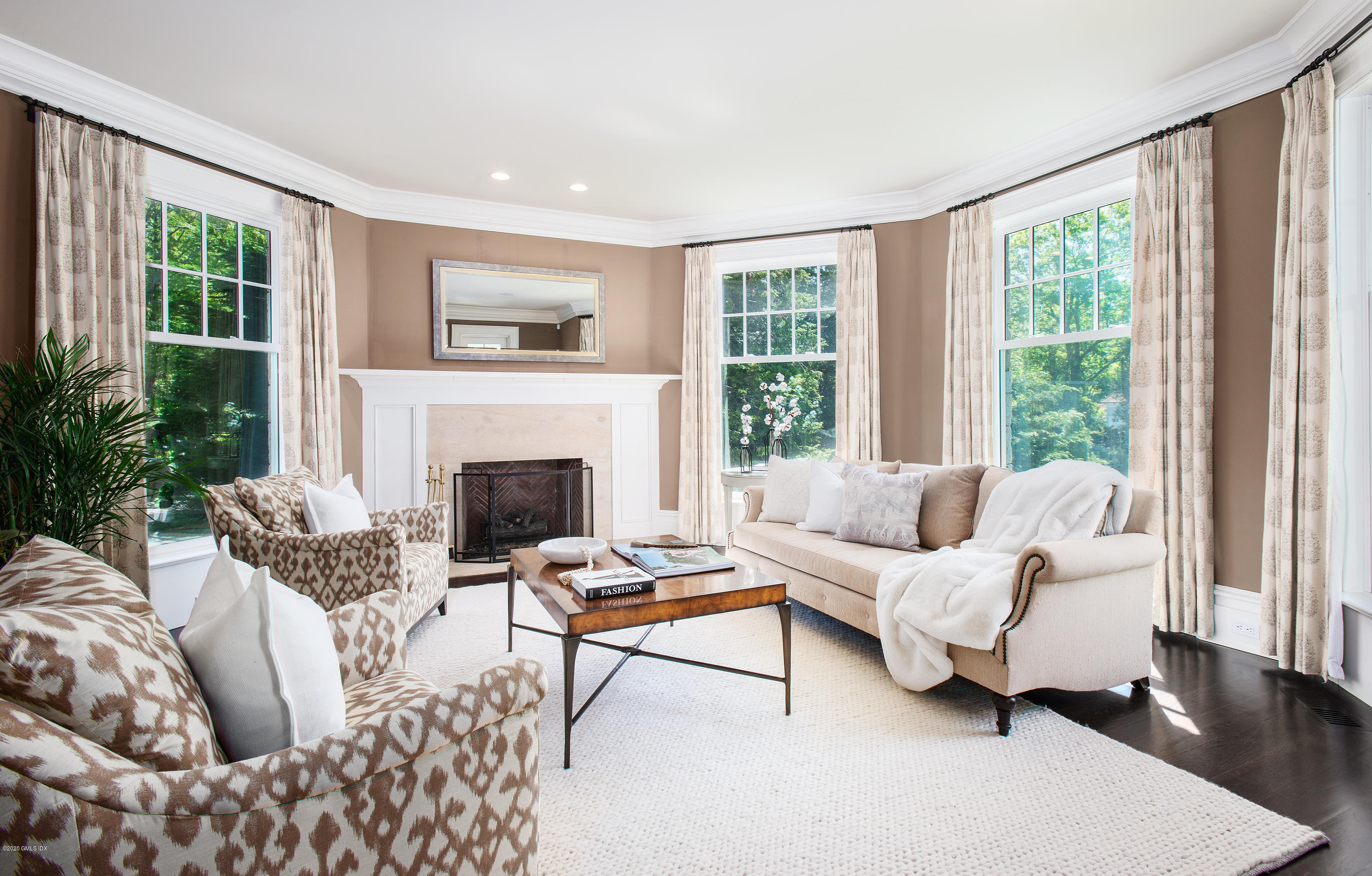 136 Parsonage Road Greenwich, CT 06830 - Photo 4 of 35 a living room with furniture and a fireplace