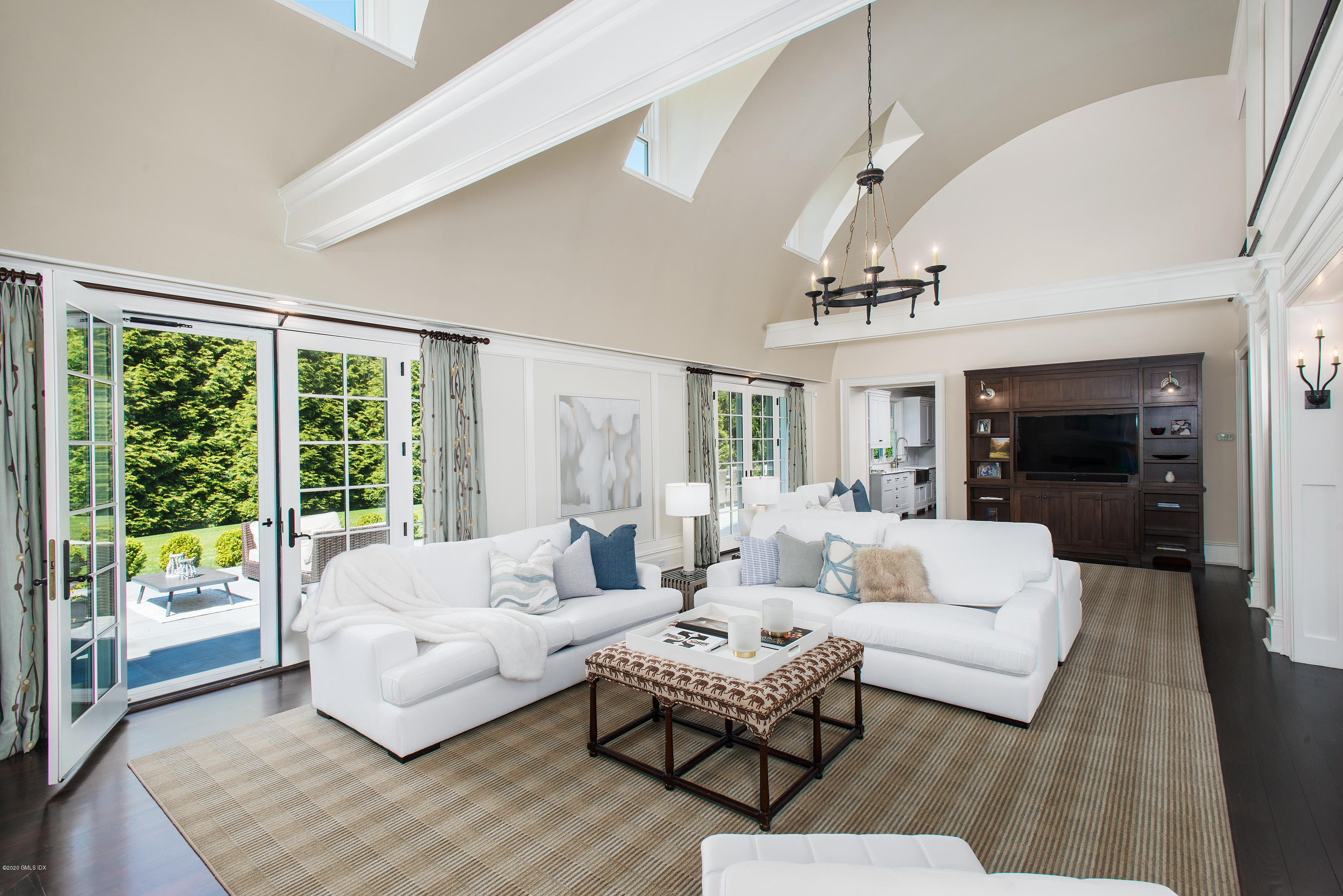 136 Parsonage Road Greenwich, CT 06830 - Photo 5 of 35 a living room with furniture and a large window
