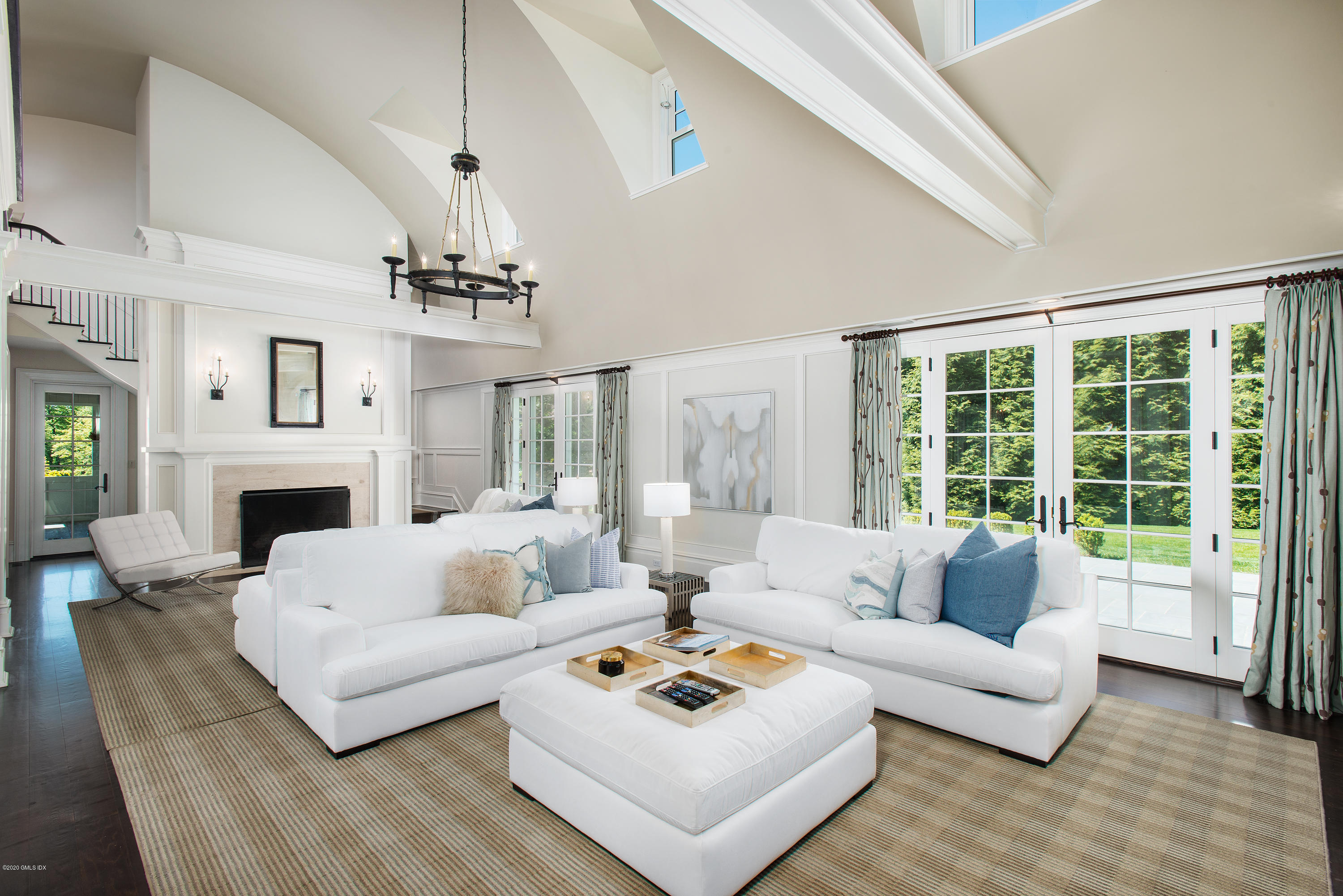 136 Parsonage Road Greenwich, CT 06830 - Photo 6 of 35 a living room with furniture fireplace and a large window