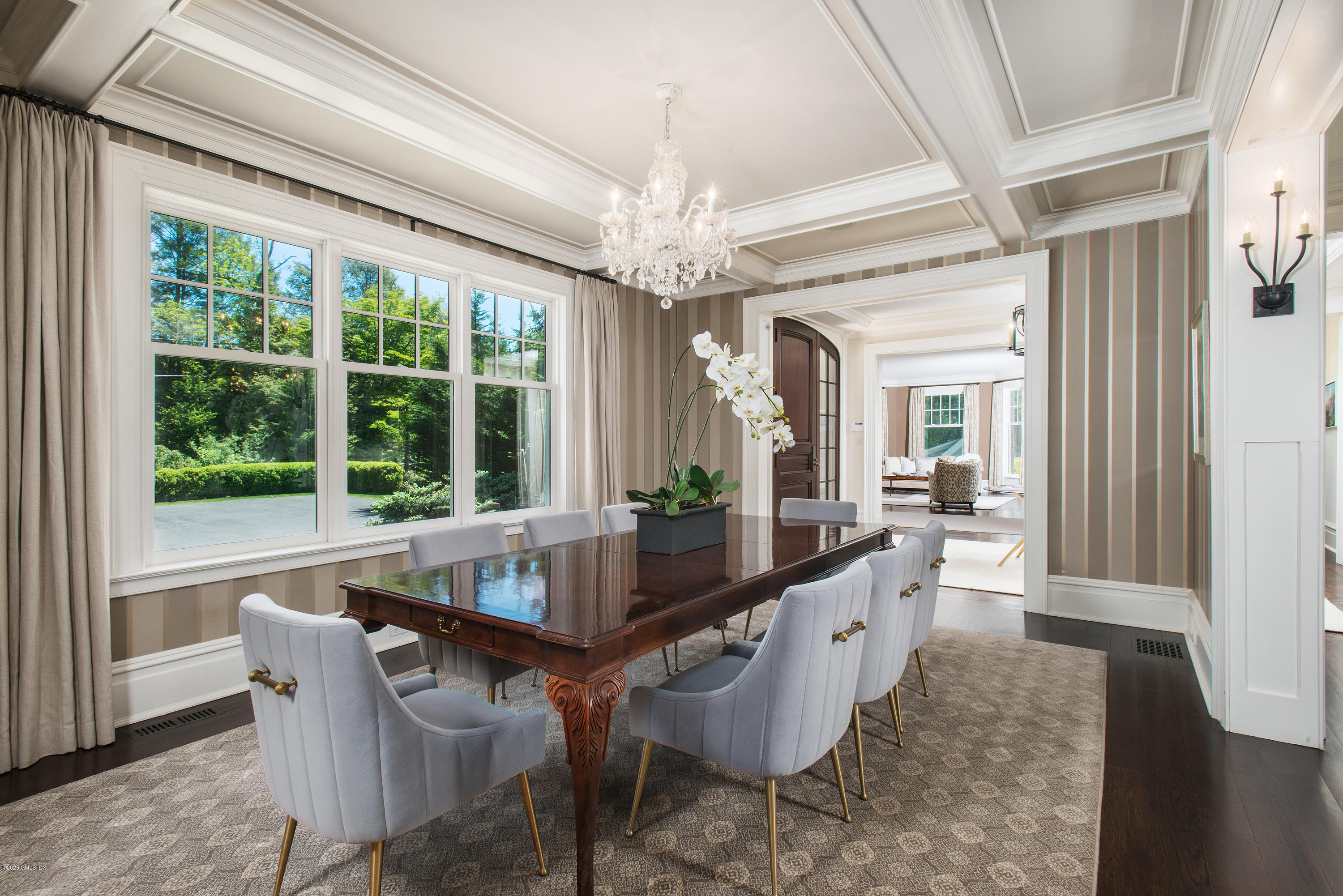 136 Parsonage Road Greenwich, CT 06830 - Photo 8 of 35 a dining room with furniture a chandelier and wooden floor