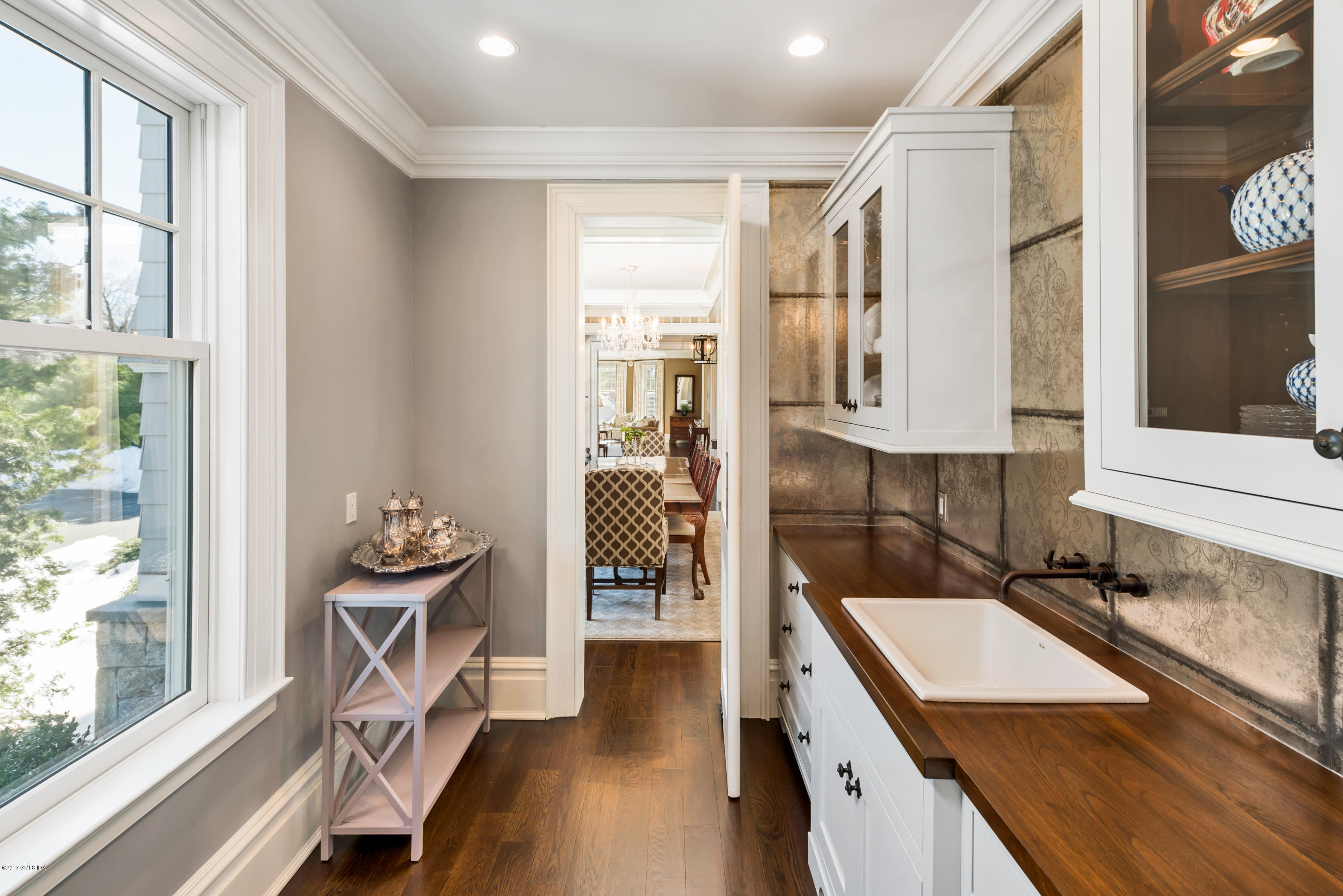 136 Parsonage Road Greenwich, CT 06830 - Photo 9 of 35 a kitchen with granite countertop a sink stove and cabinets