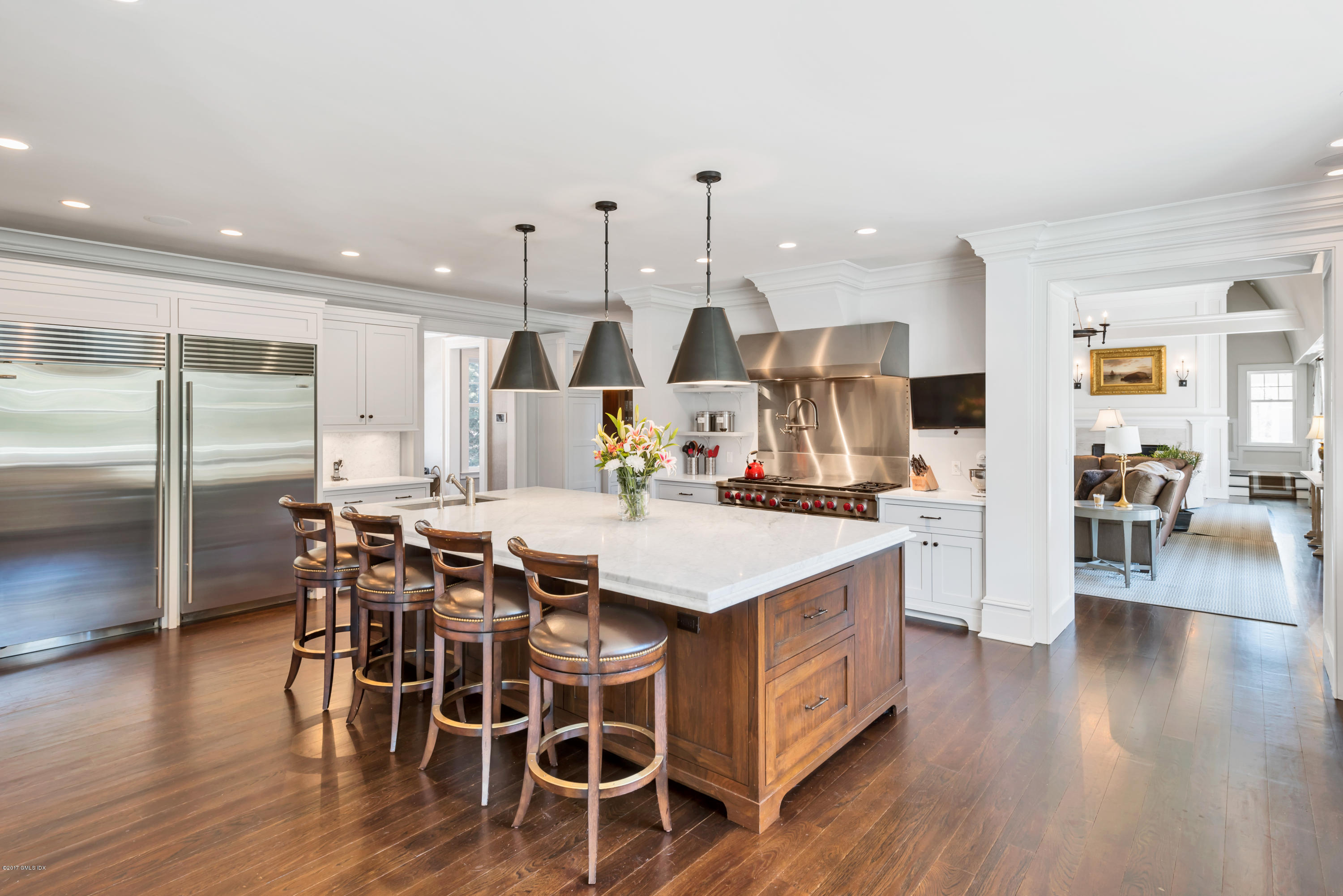 136 Parsonage Road Greenwich, CT 06830 - Photo 10 of 35 a large kitchen with a table and chairs