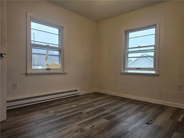 a bathroom with a shower and a toilet