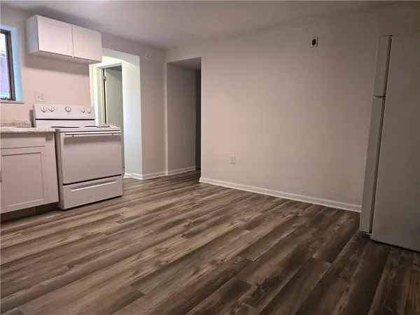 a kitchen with sink cabinets and window