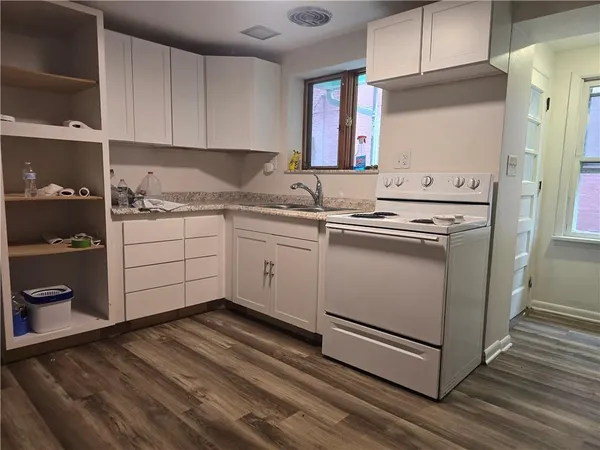 a view of a livingroom with wooden floor