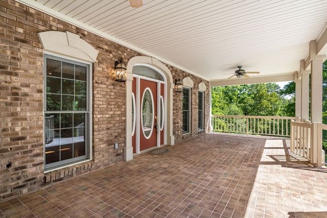 1190 Maple Grove Road Morganton, GA 30560 - Photo 15 of 96 a view of a porch with wooden floor and iron stairs