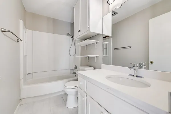 a bathroom with a sink a toilet and a bathtub