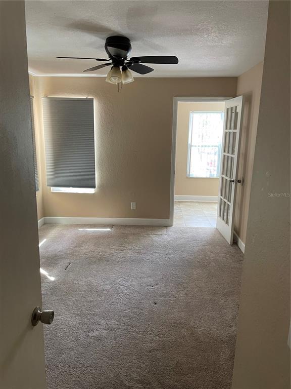 4512 Commander Drive, Unit 1725 Orlando, FL 32822 - Photo 12 of 17 a view of an empty room with a window