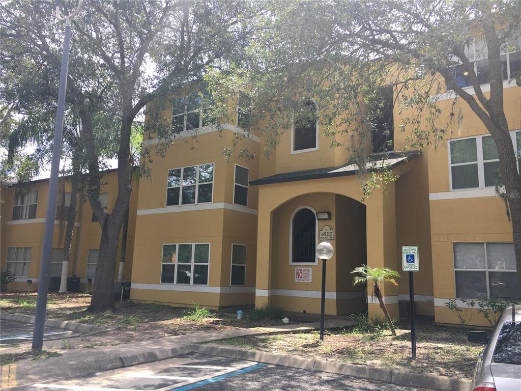 4512 Commander Drive, Unit 1725 Orlando, FL 32822 - Photo 2 of 17 a front view of a building with street view