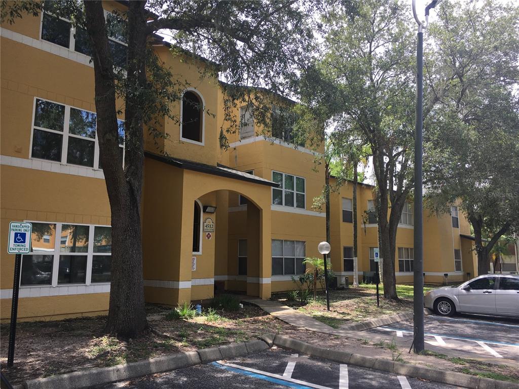 4512 Commander Drive, Unit 1725 Orlando, FL 32822 - Photo 3 of 17 a front view of a house with parking space