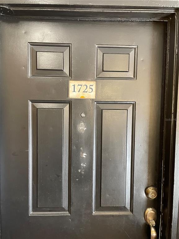 4512 Commander Drive, Unit 1725 Orlando, FL 32822 - Photo 4 of 17 a front view of a house with entryway