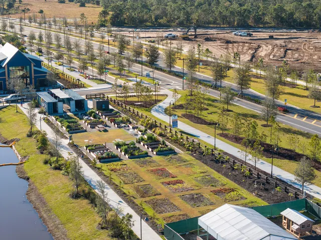 a view of swimming pool with a lawn chairs