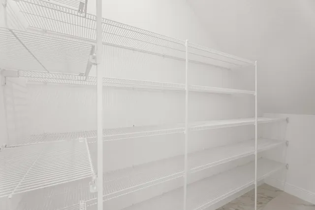 a large kitchen with stainless steel appliances granite countertop a sink stove and refrigerator