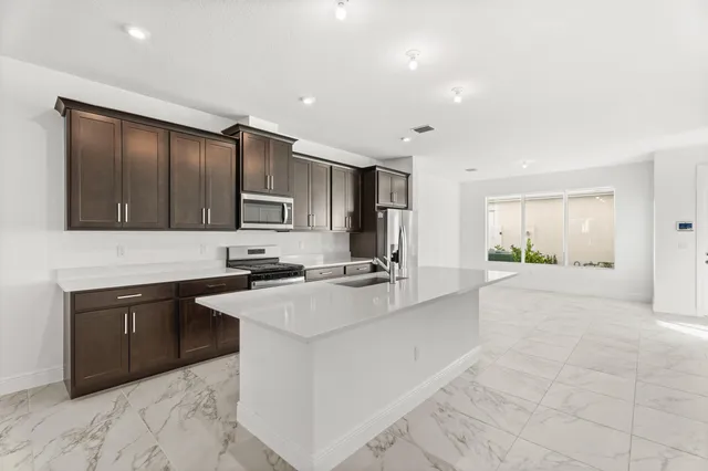 a kitchen with a sink and cabinets