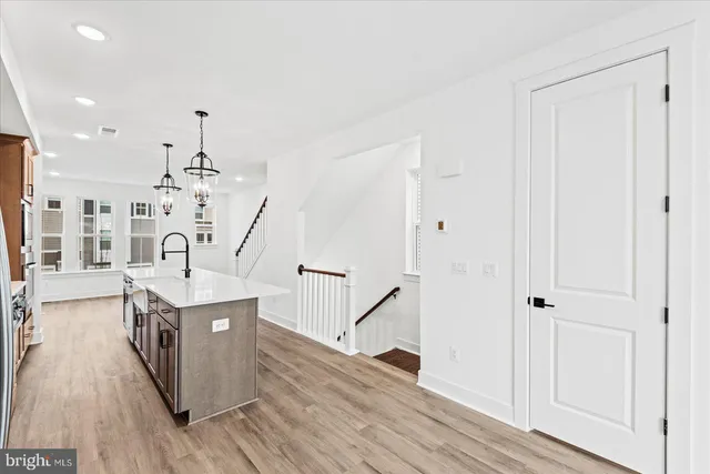 a spacious bathroom with a sink mirror and vanity