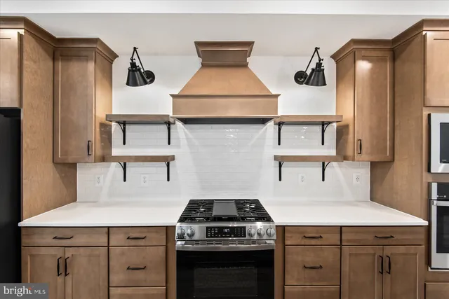 a kitchen with cabinets and appliances