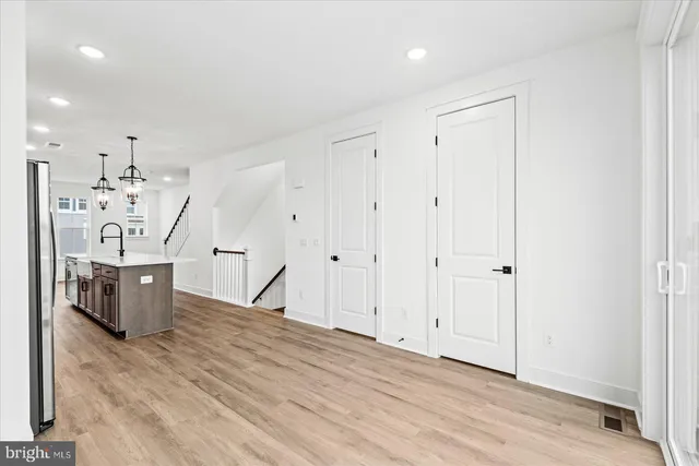 a view of a room with wooden floor