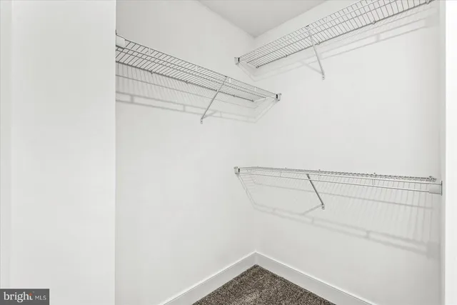 a view of a room with racks on the wall