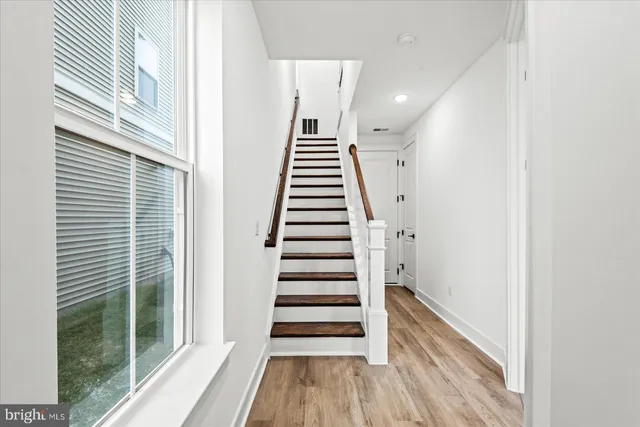 a view of entryway with wooden floor