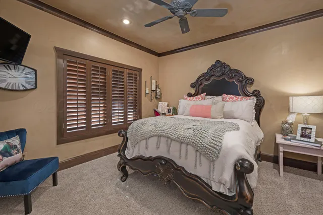 a spacious bedroom with a bed and cabinets