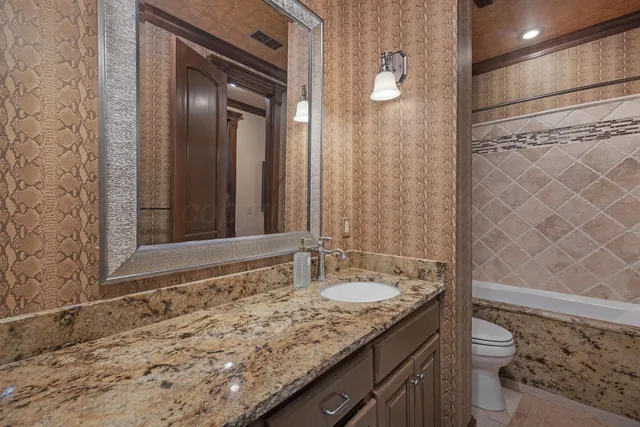 a bathroom with a bathtub and shower