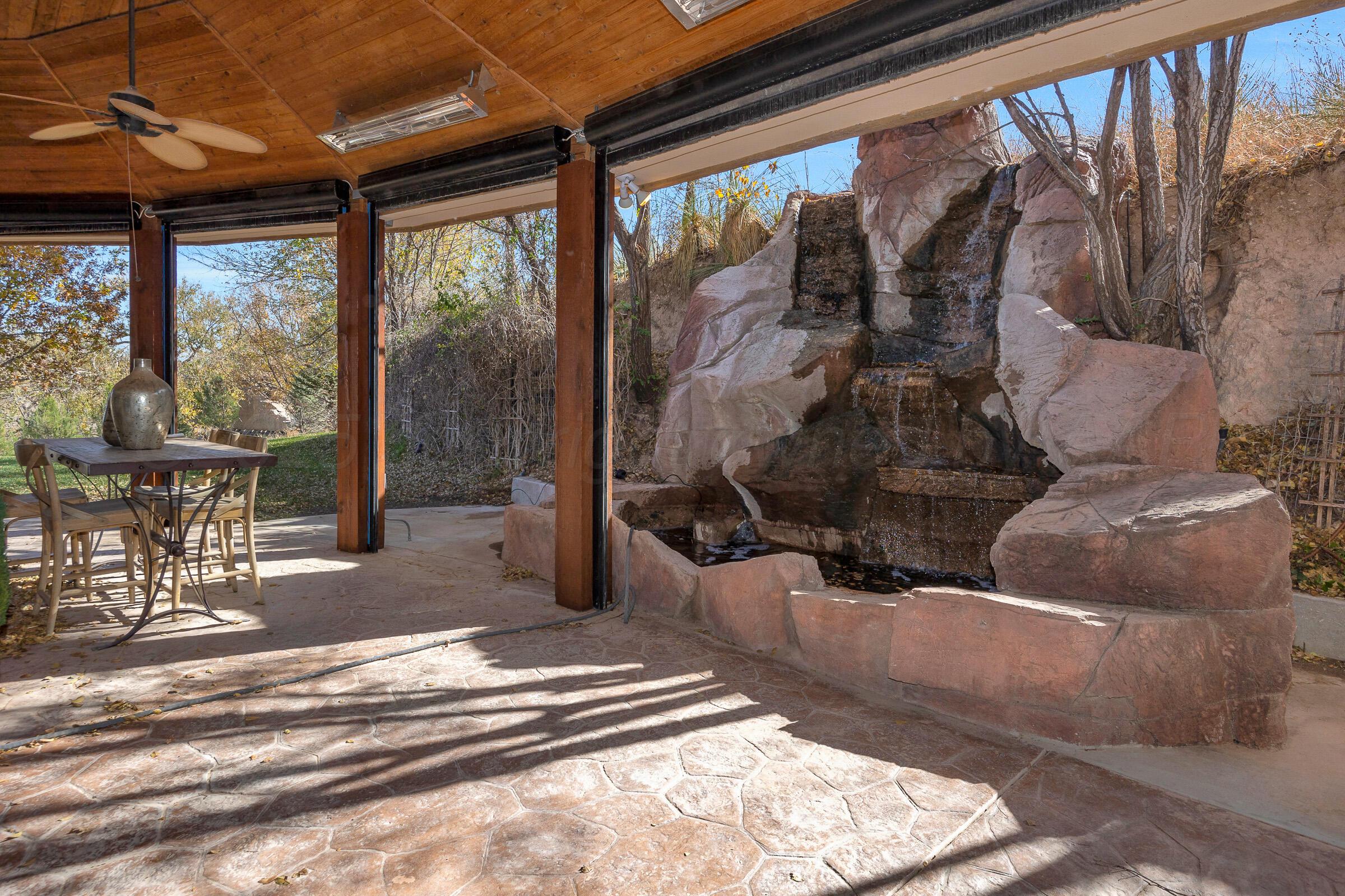 19551 Chaparral Road Canyon, TX 79015 - Photo 33 of 42 a living room with couches and a dining table with garden view