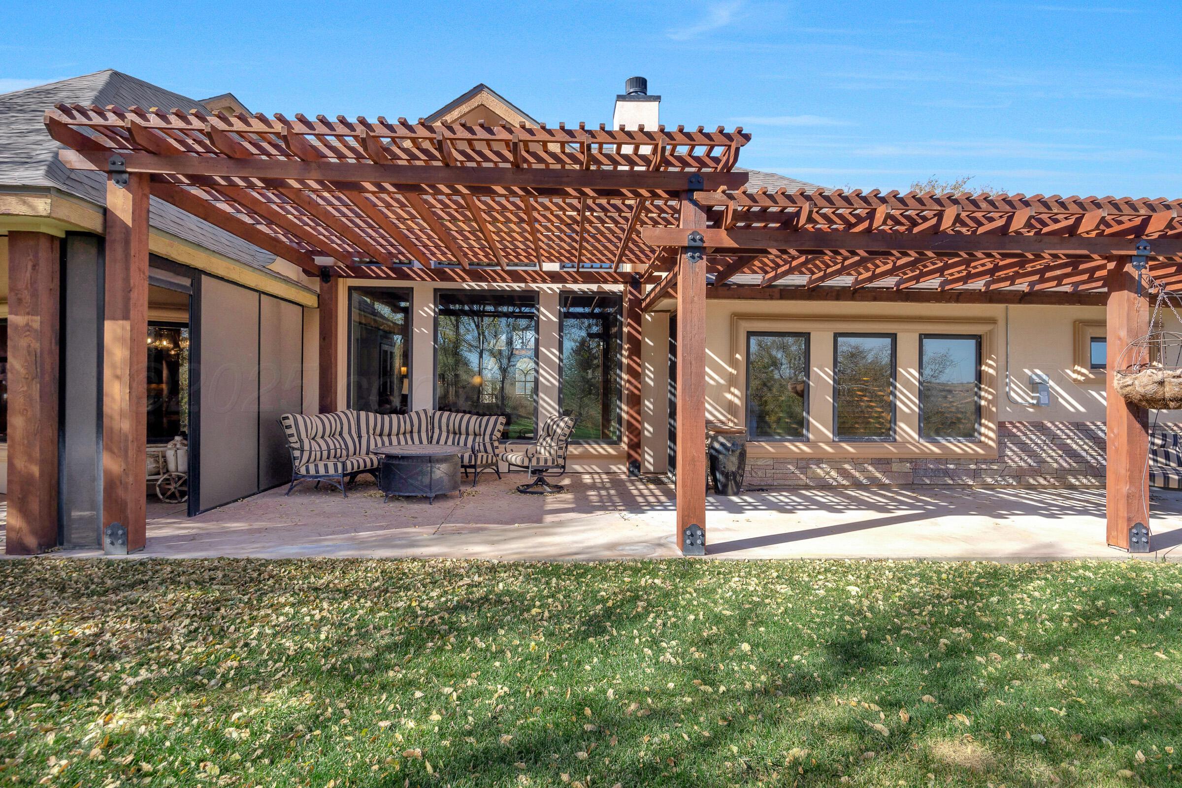 19551 Chaparral Road Canyon, TX 79015 - Photo 36 of 42 a view of a house with backyard and porch