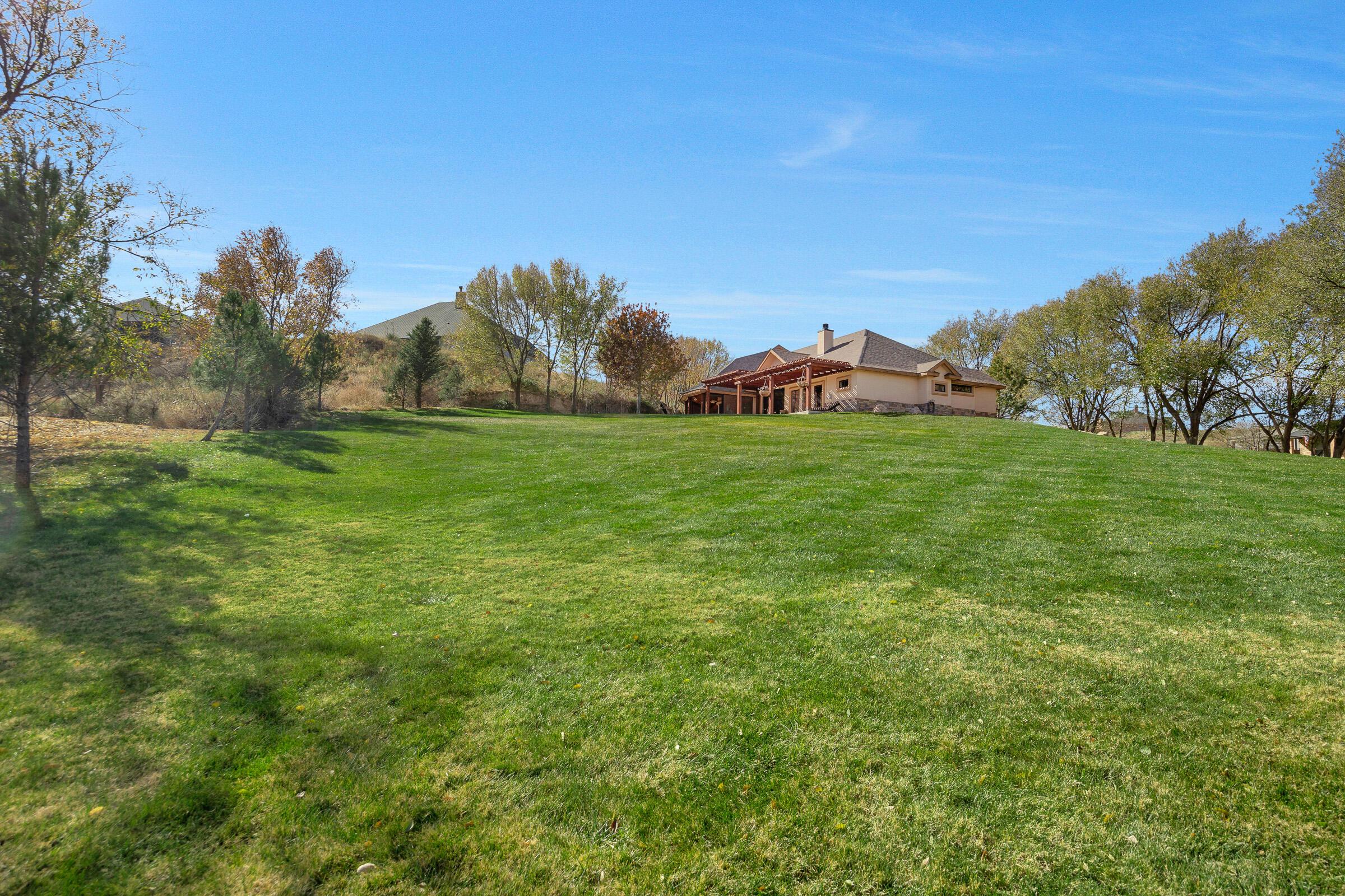19551 Chaparral Road Canyon, TX 79015 - Photo 39 of 42 a view of a big yard with a house in the background
