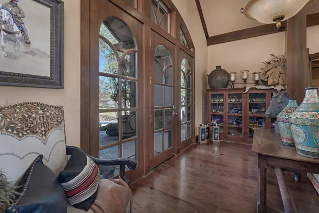 a living room with furniture a rug and a chandelier